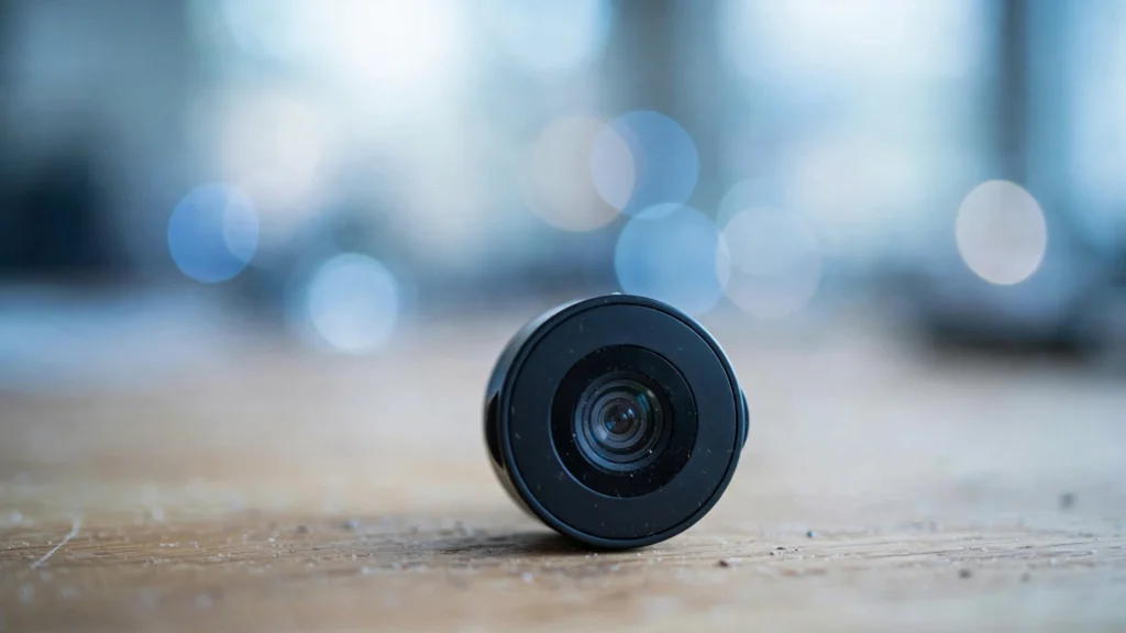 Close-up of a webcam lens on a desk